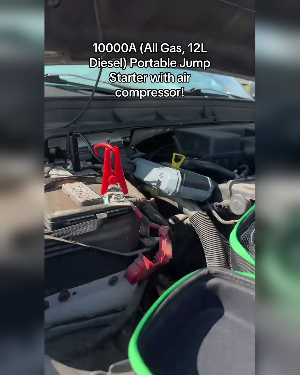 BIUBLE jump starter connected to a 12 V vehicle battery